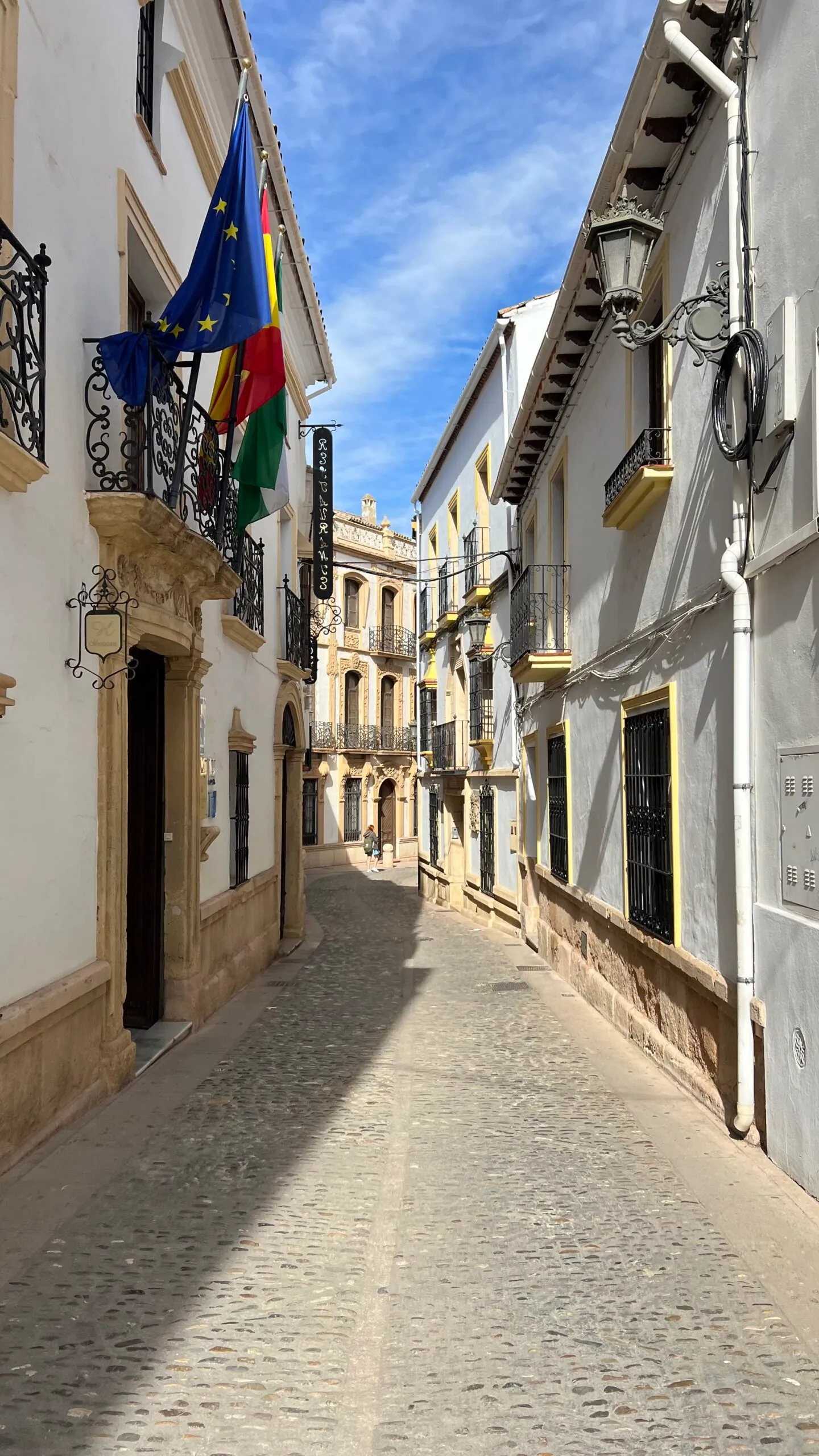 Alley in Sevilla, Spain with coffee shops