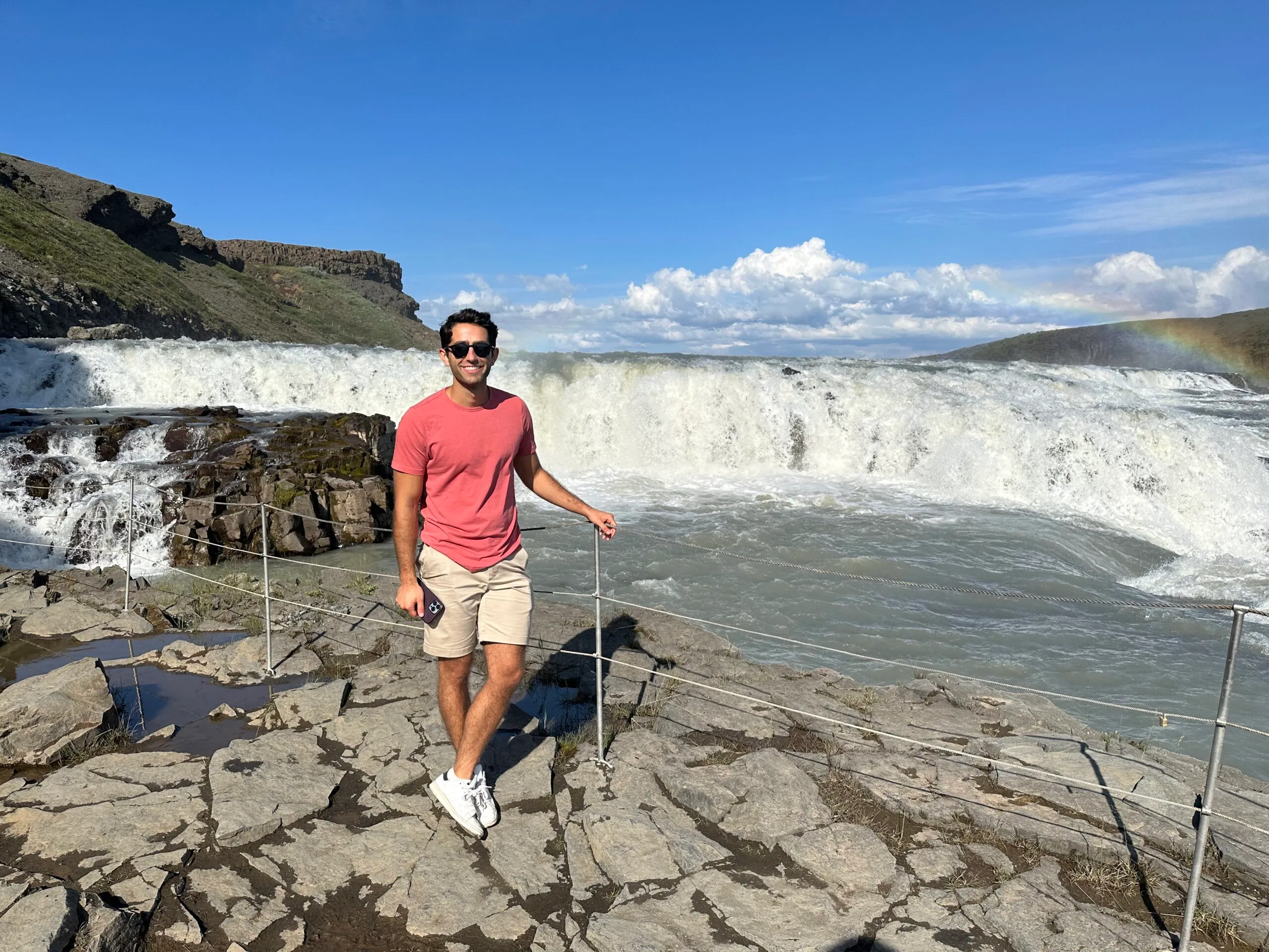 Author of Imperfect Nostalgia in front of waterfall in Iceland in 2023