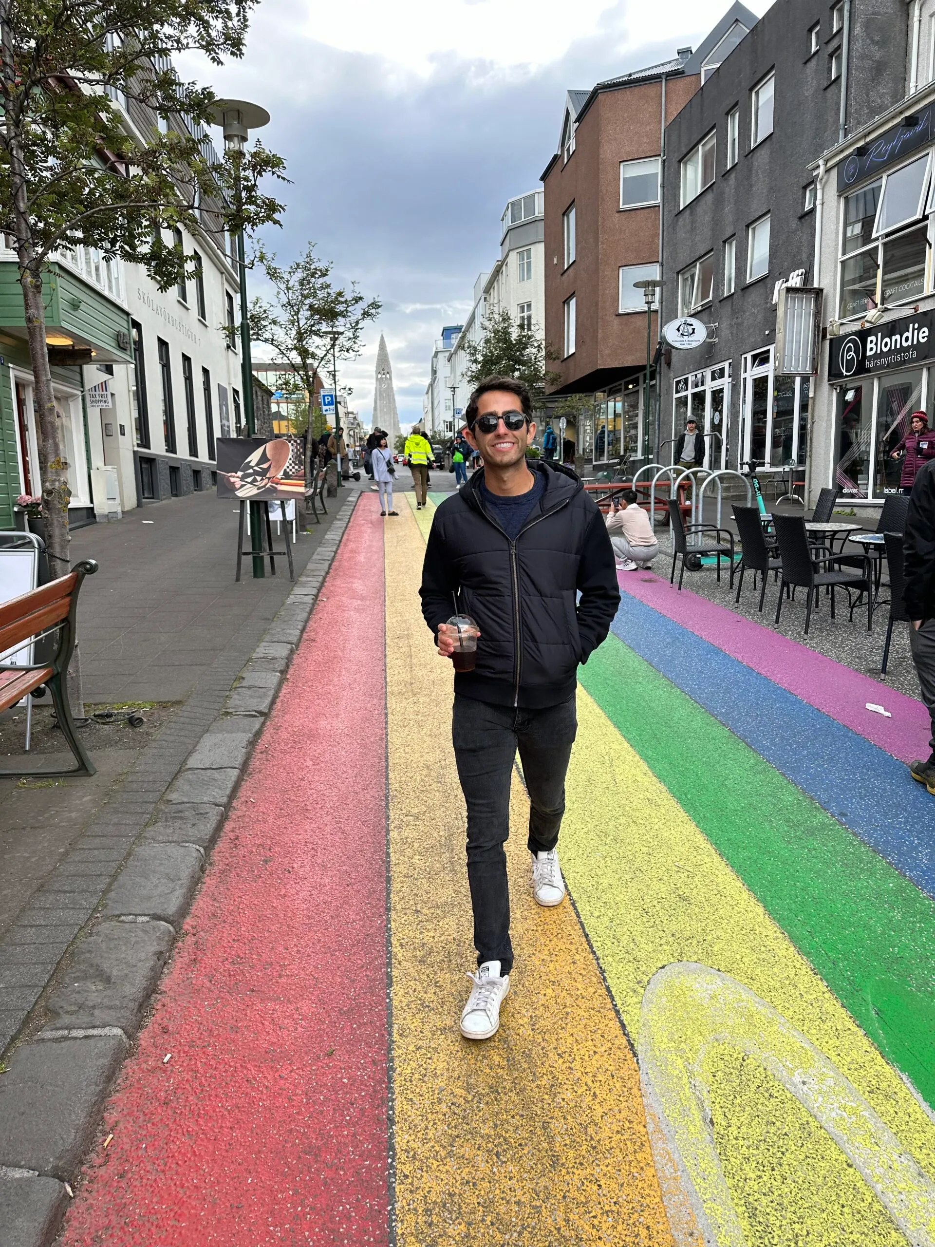 Imperfect Nostalgia founder on rainbow sidewalk in Reykjavík, Iceland