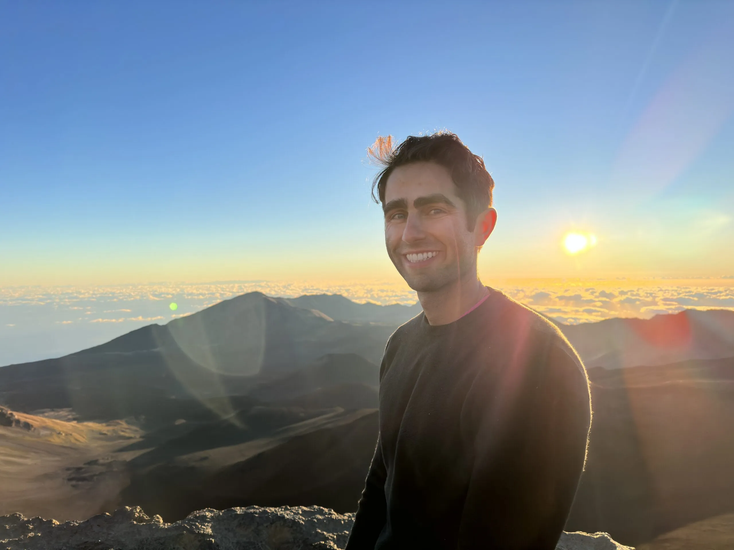 Founder of Imperfect Nostalgia at the top of Haleakalā National Park at sunrise