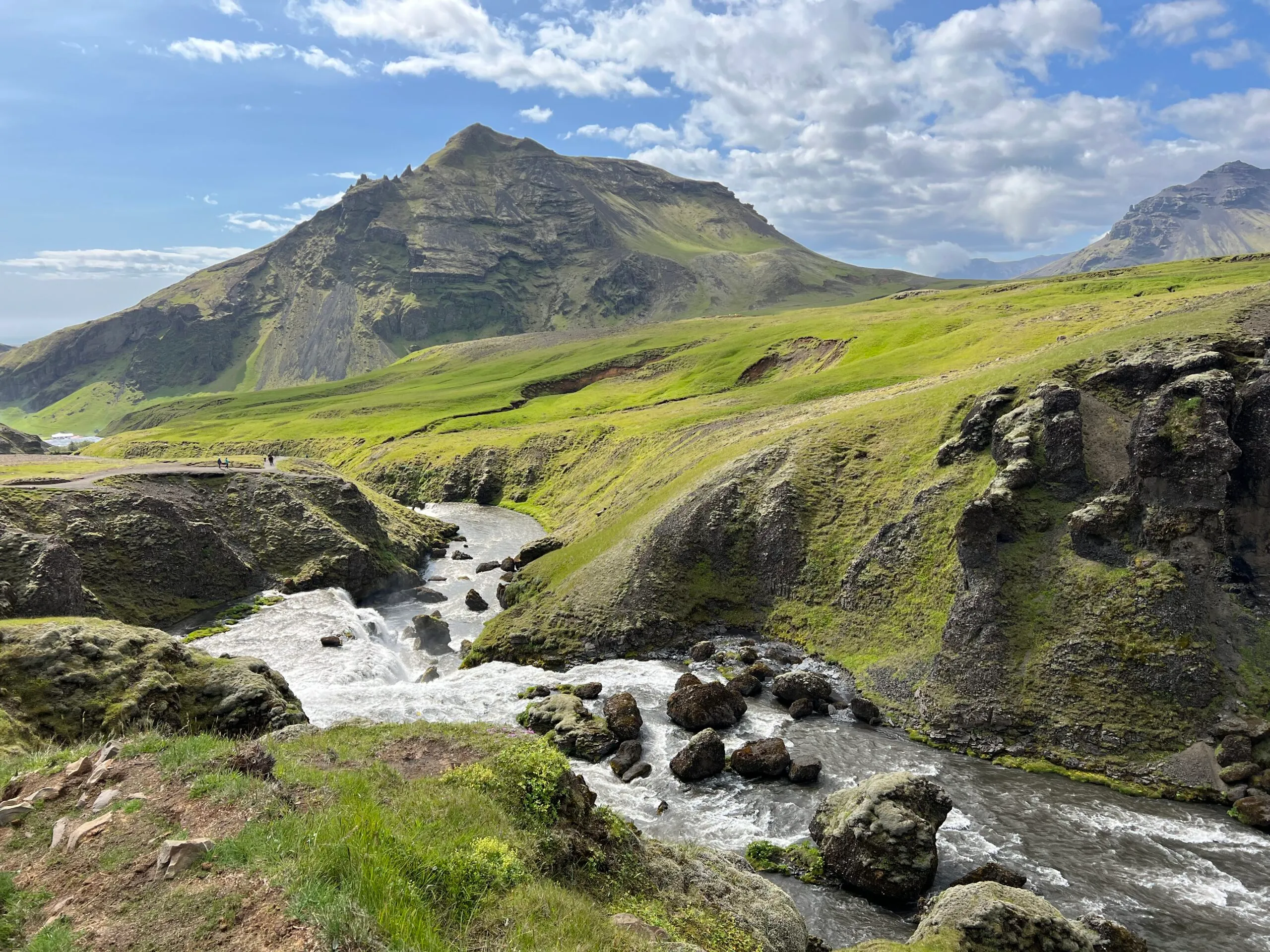 7-Day summer Iceland Itinerary cover photo - skogafoss river and waterfall an mountain