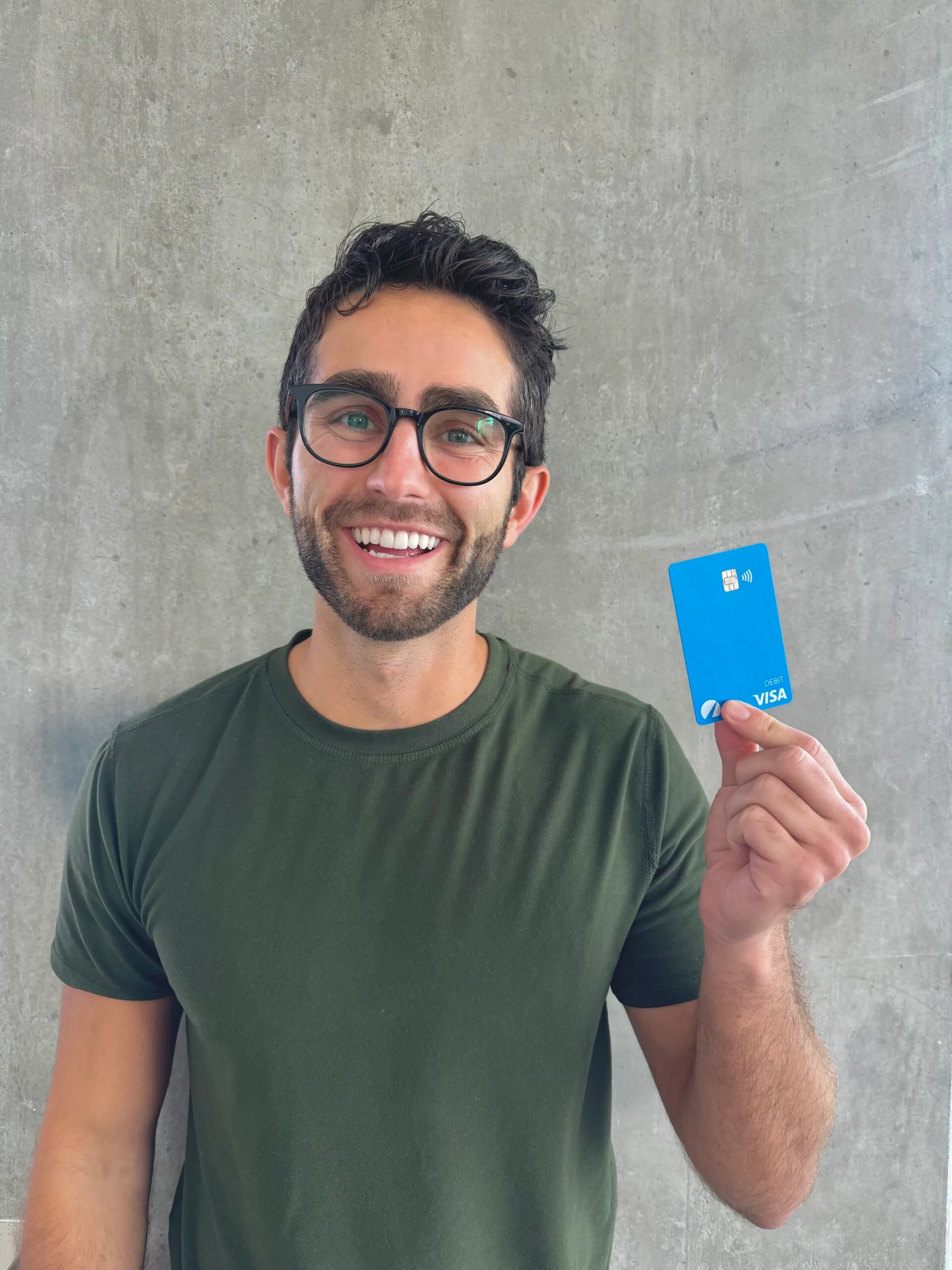 Author holding his Betterment Debit Card to take out cash internationally for free